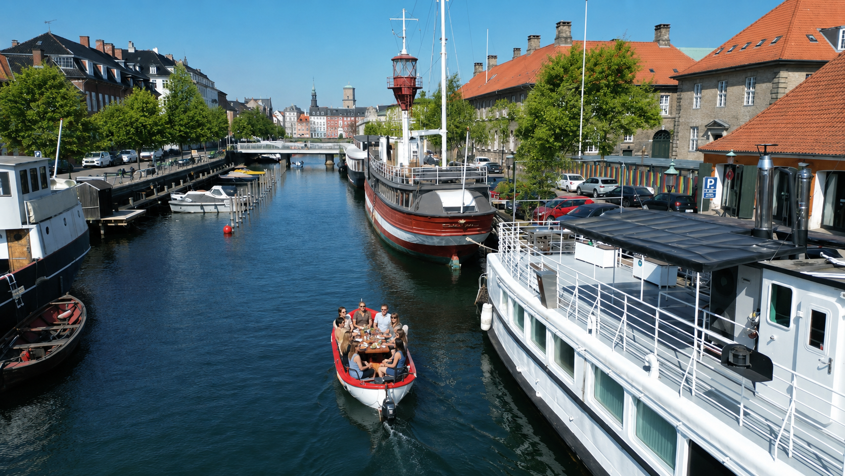 Private boat cruising through a Christianshavn canal