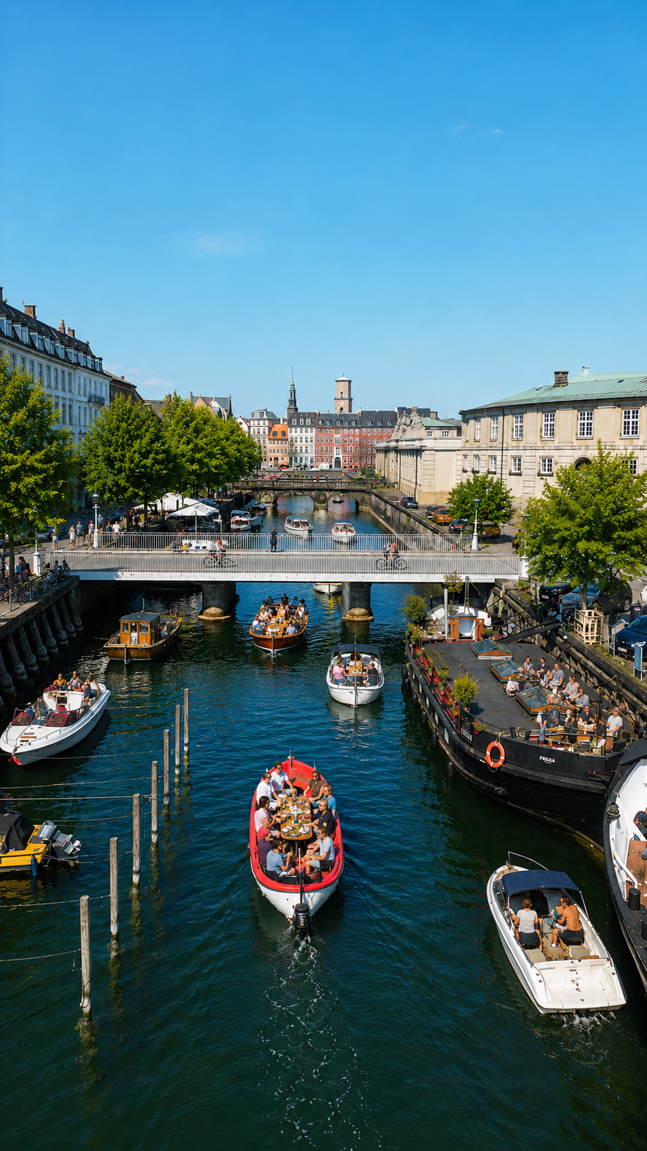 Copenhagen canal alive with boats on a summer afternoon